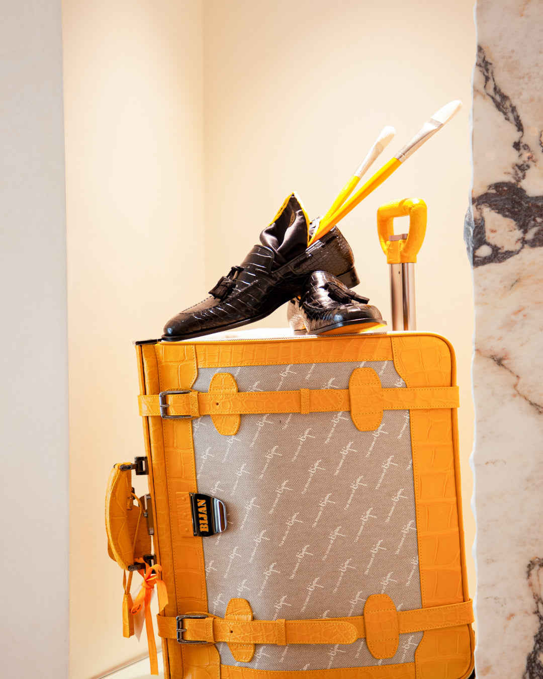 a suitcase with a pair of shoes on top of it