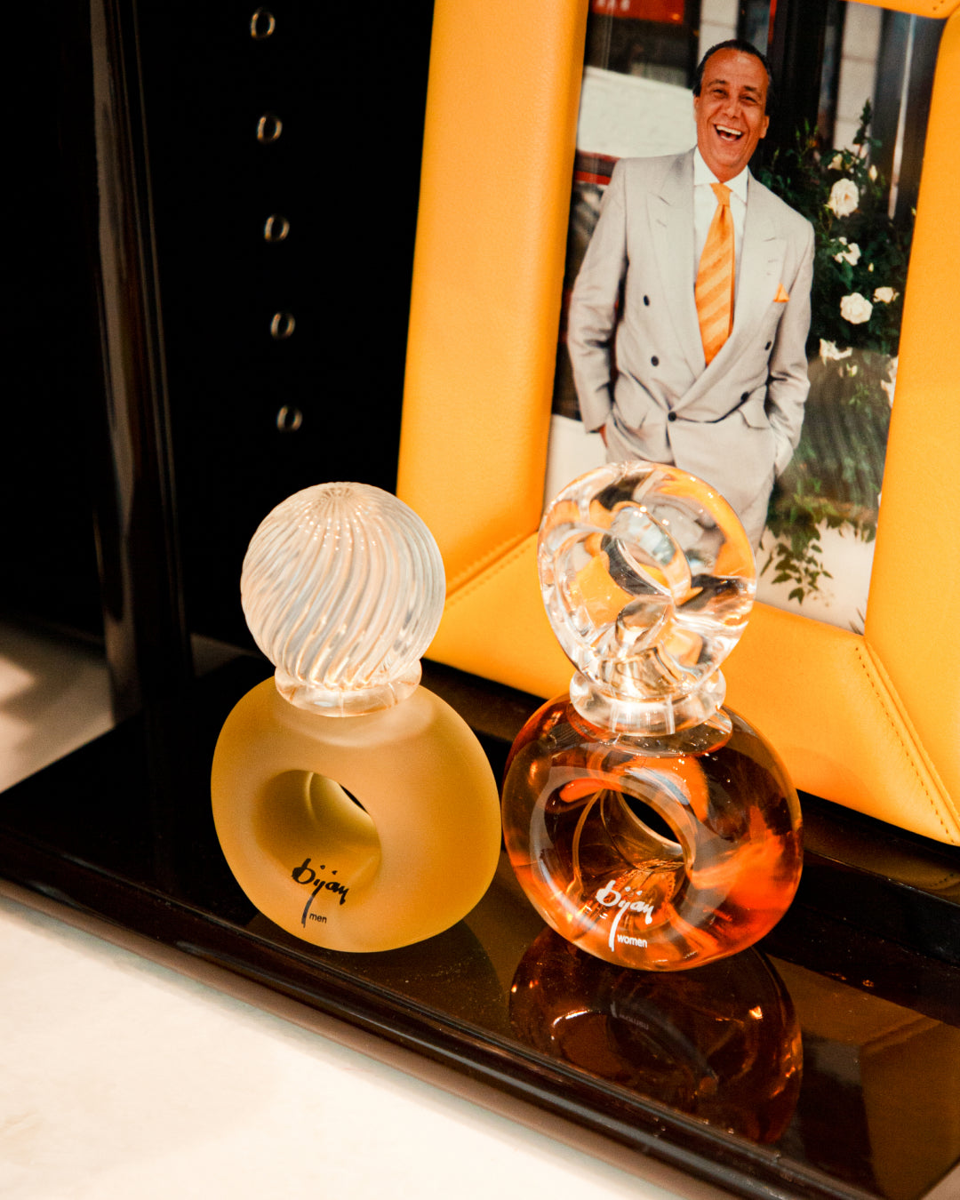 a couple of perfume bottles sitting on top of a table