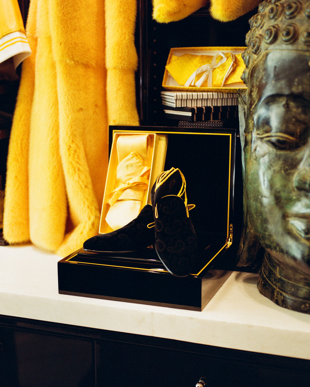 a pair of black shoes sitting on top of a counter