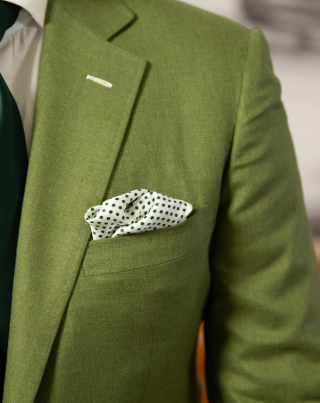 Bijan green suit with polka dot handkerchief details in front pocket