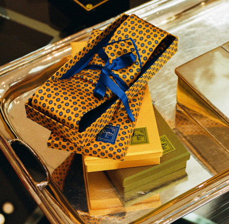 a stack of yellow and blue wrapping paper