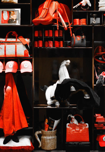 a shelf filled with lots of red and white items