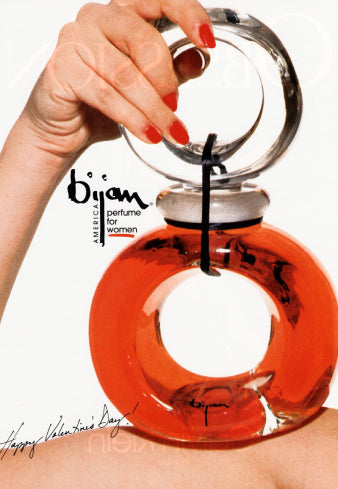 a magazine cover with a woman holding an orange object