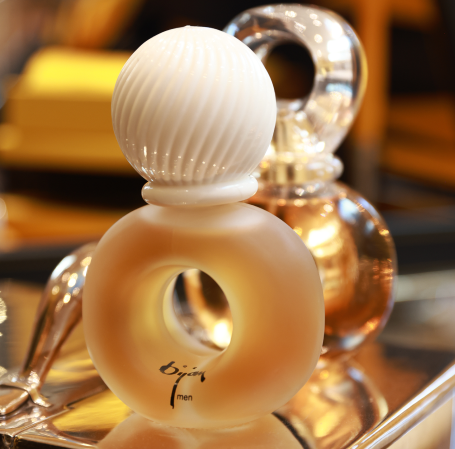 a bottle of perfume sitting on top of a table