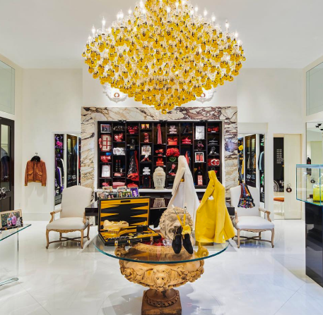 a clothing store with a chandelier hanging from the ceiling