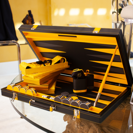 a yellow and black case with a pair of scissors in it