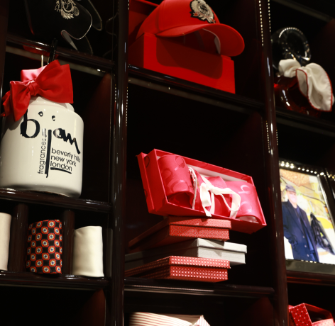 a shelf filled with lots of different types of hats