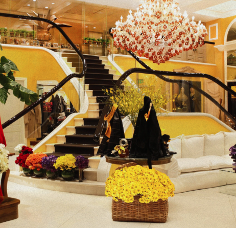 a living room filled with furniture and a chandelier